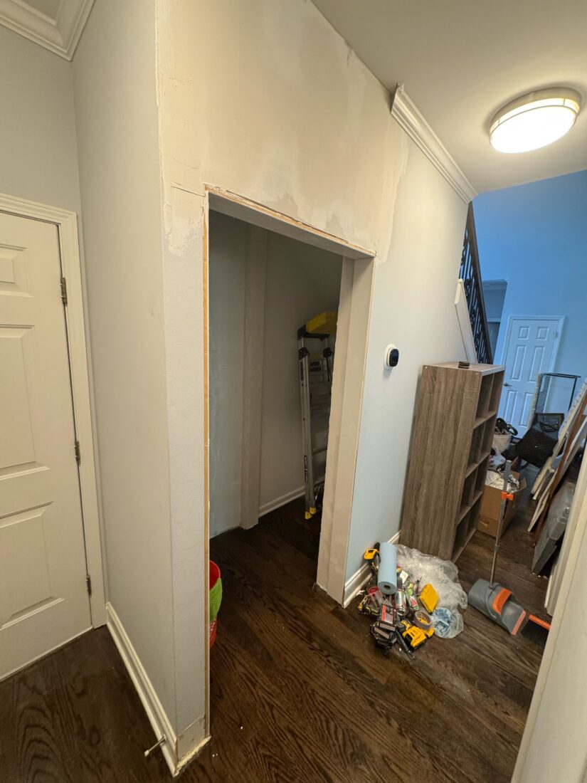 Before: an open, cluttered nook with no doors or shelving