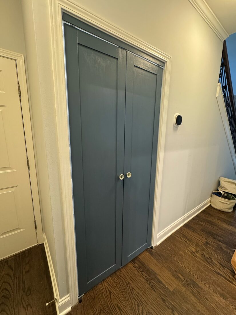 After: new painted blue-gray double doors on the finished pantry